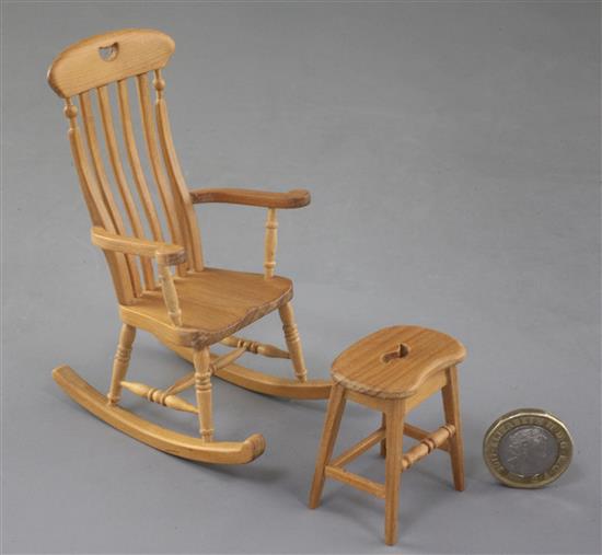 Denis Hillman. A Victorian style beech miniature rocking armchair and matching stool with a saddle shaped seat, height of rocking chair